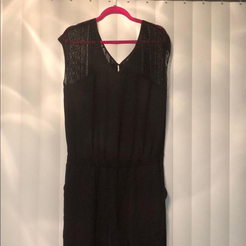 Black pant jumpsuit with lace top and slit